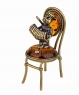 Cat with an accordion on a chair D77I95